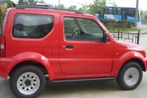 Suzuki Jimny 1998-2018 гг. Боковые трубы Black (2 шт., нержавейка) фото 1