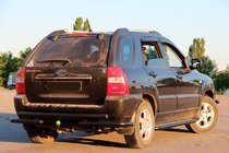 Kia Sportage 2004-2010 гг. Задняя дуга AK007 Черная (нерж. сталь) фото 2