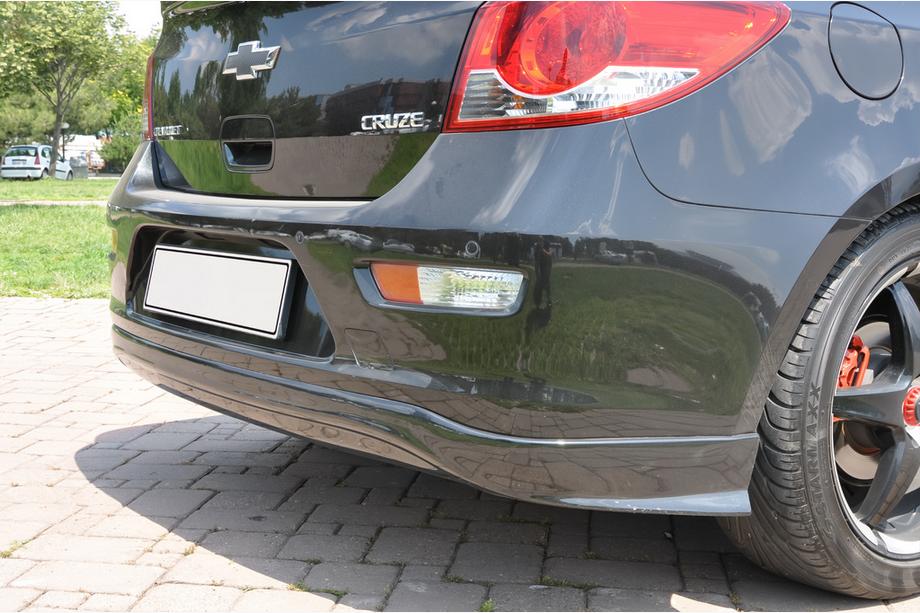 Chevrolet Cruze 2009–2015 гг. Накладка на задний бампер HB (Meliset, грунтованная под покраску) Image