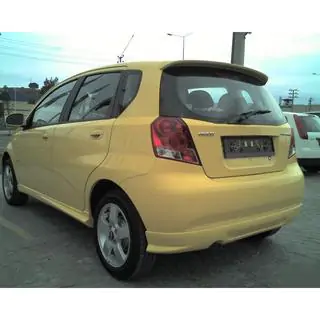 Накладка на задний бампер (грунтованная под покраску) Chevrolet Aveo T200 2002-2008 гг. фото 1